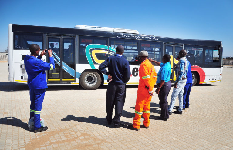 Technical employees discussing the Leeto bus service